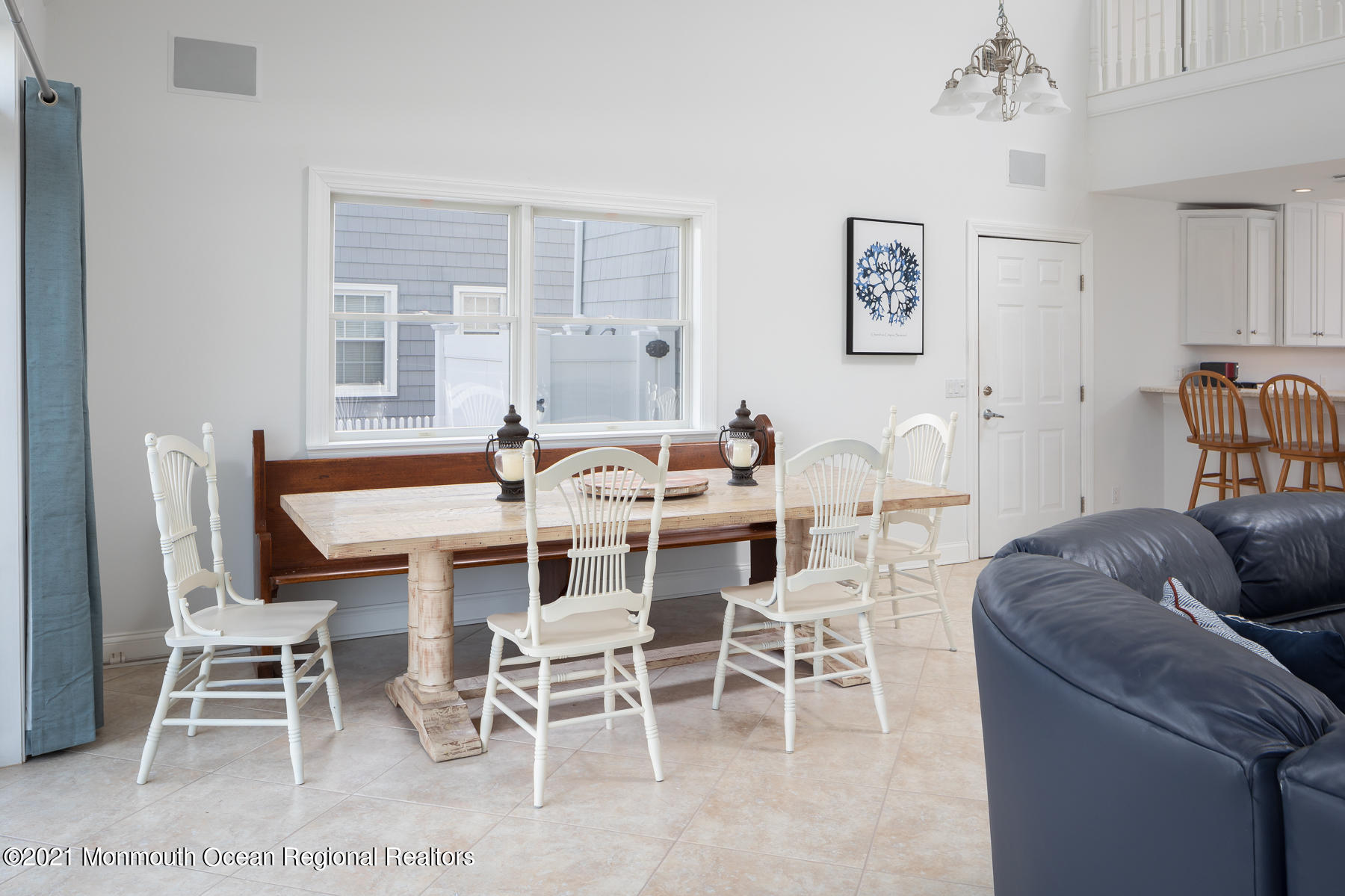 304 Cutter Lane Mantoloking, NJ 08738 - Photo 23 of 54 a dining room with furniture a rug and a chandelier
