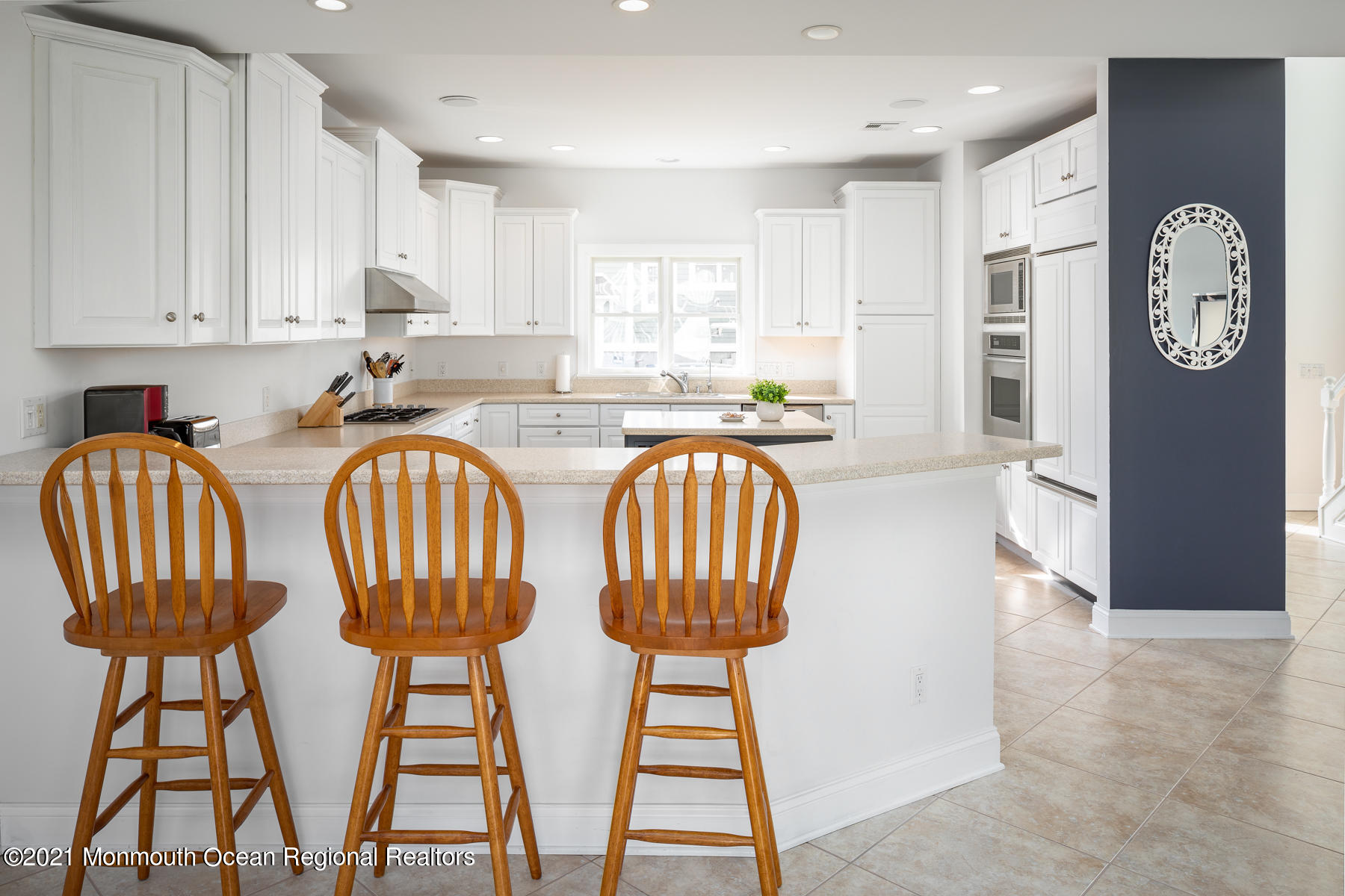304 Cutter Lane Mantoloking, NJ 08738 - Photo 24 of 54 a kitchen with dining table and chairs