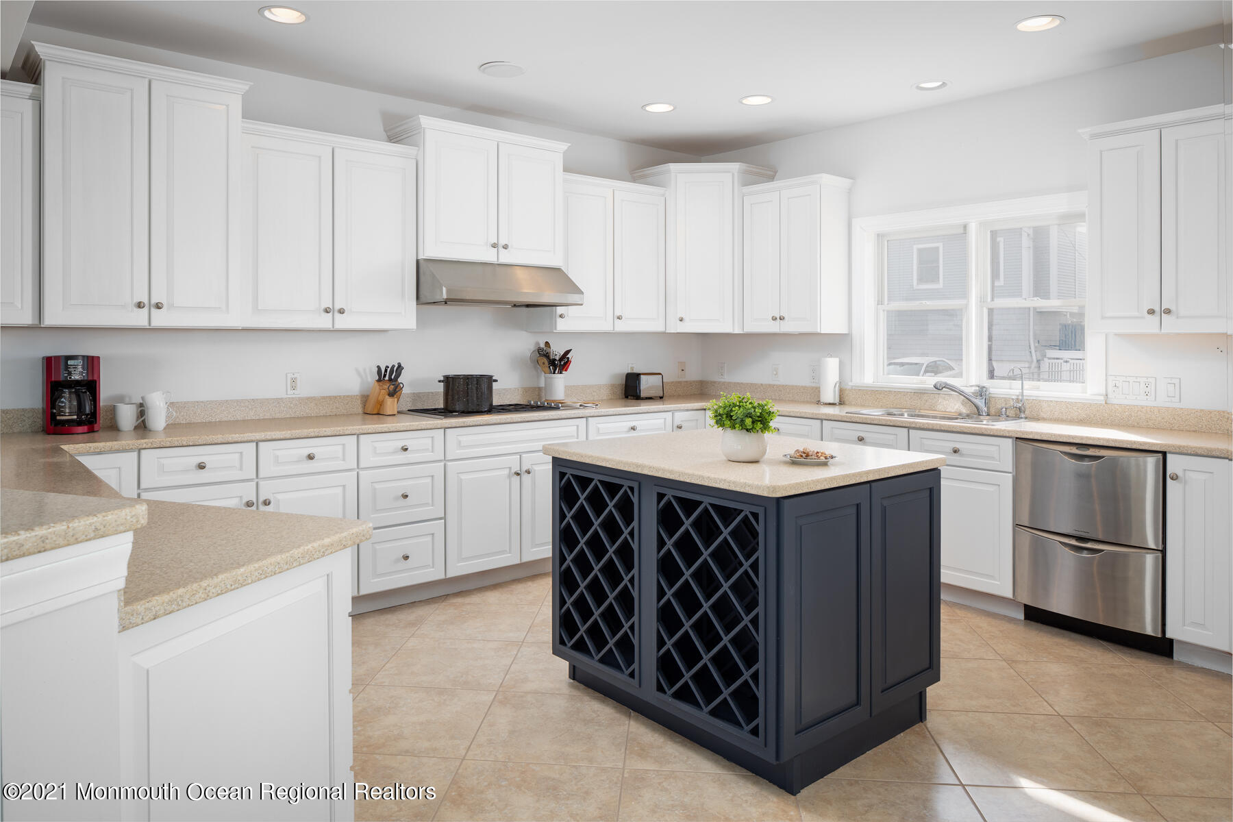 304 Cutter Lane Mantoloking, NJ 08738 - Photo 25 of 54 a kitchen with kitchen island granite countertop a sink stove and cabinets