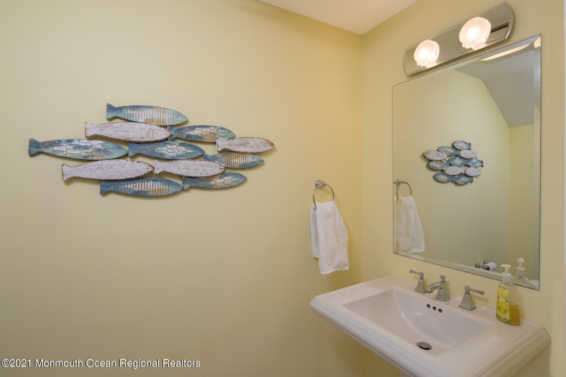 304 Cutter Lane Mantoloking, NJ 08738 - Photo 26 of 54 a bathroom with a sink mirror and vanity