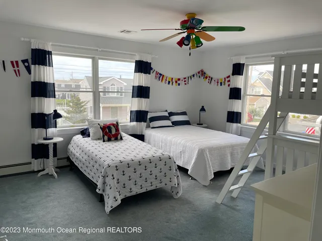 a bedroom with furniture and a window