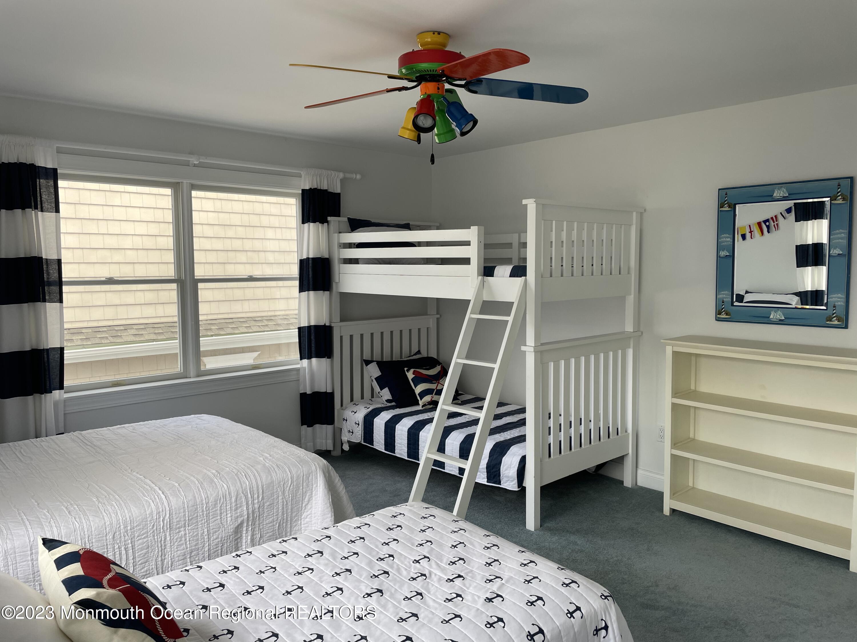 304 Cutter Lane Mantoloking, NJ 08738 - Photo 31 of 54 a bedroom with furniture and a window