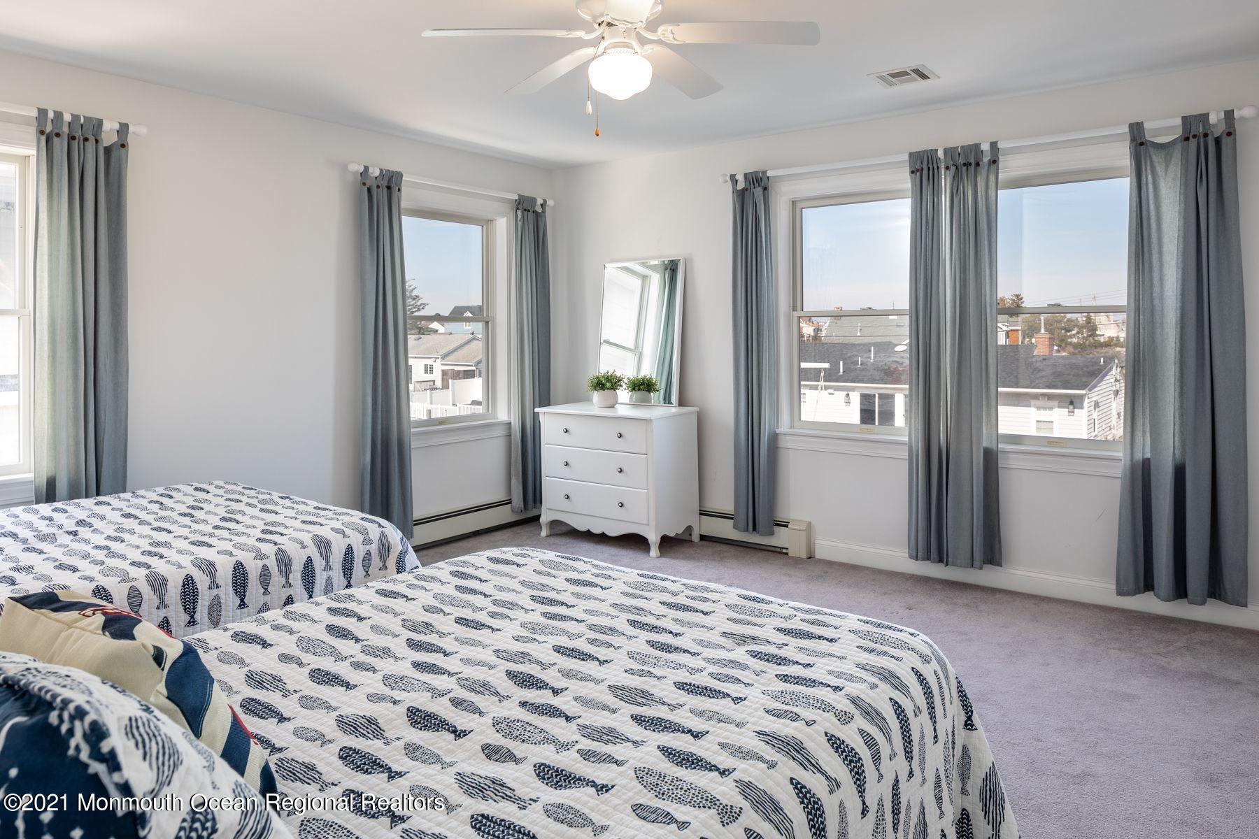 304 Cutter Lane Mantoloking, NJ 08738 - Photo 34 of 54 a bedroom with a bed and a window