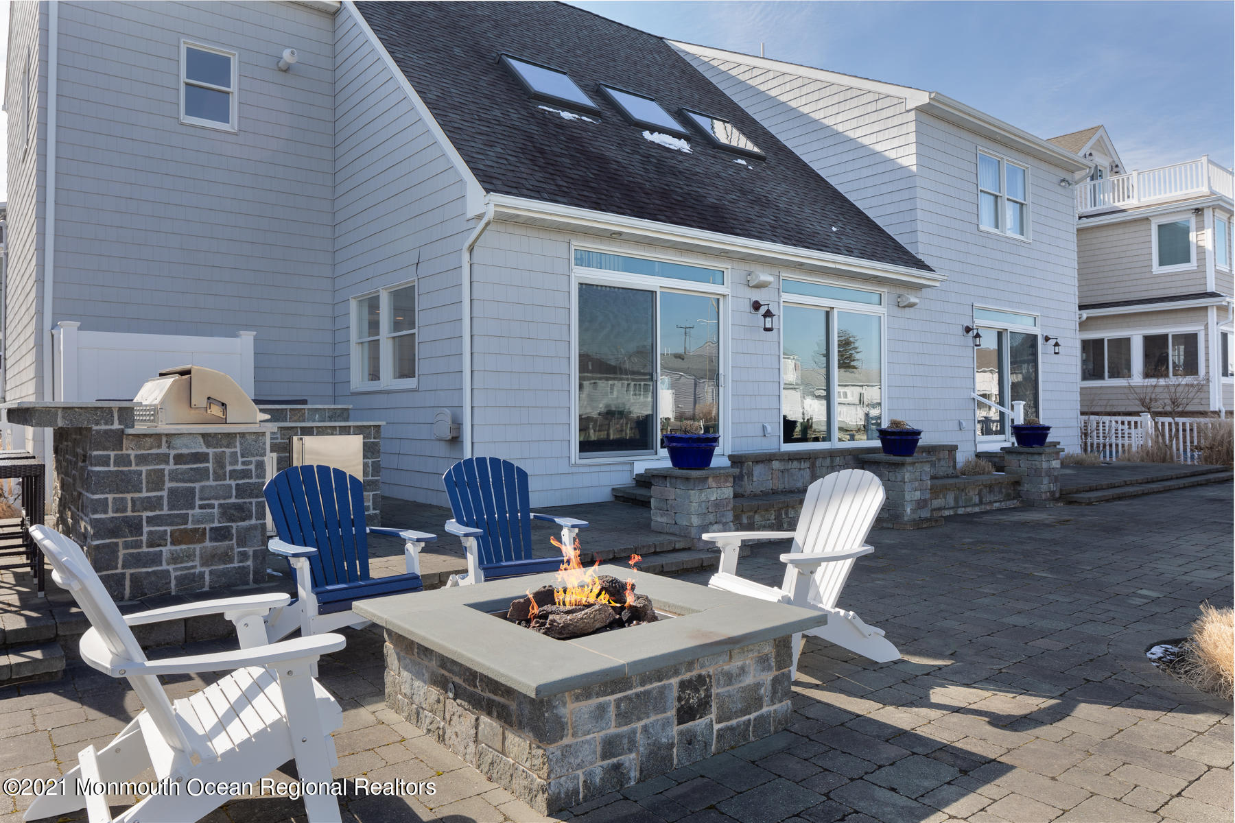 304 Cutter Lane Mantoloking, NJ 08738 - Photo 37 of 54 a view of a patio with couches table and chairs and potted plants