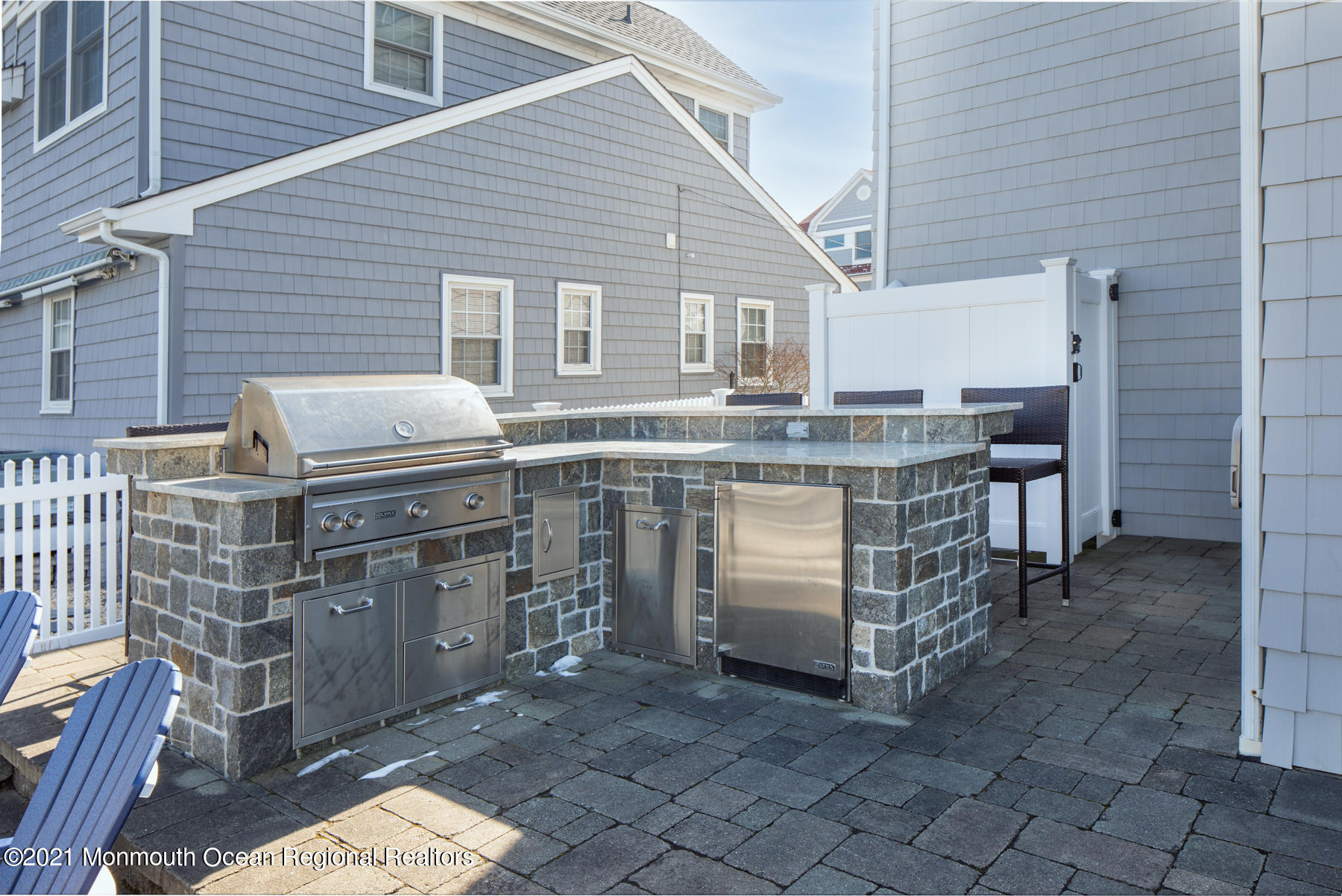 304 Cutter Lane Mantoloking, NJ 08738 - Photo 38 of 54 a view of a chairs and table in the backyard