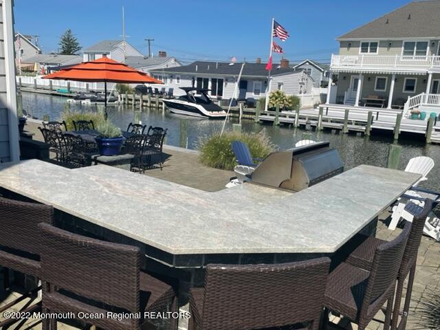 304 Cutter Lane Mantoloking, NJ 08738 - Photo 45 of 54 a swimming pool view with a seating space
