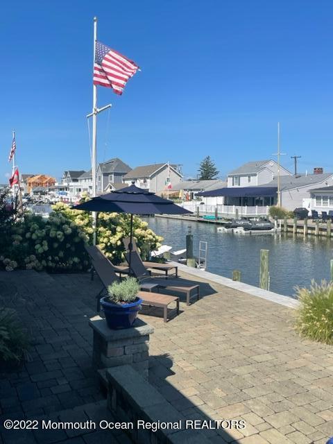 304 Cutter Lane Mantoloking, NJ 08738 - Photo 49 of 54 a view of a lake with a terrace