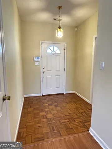 a view of a hallway with front door