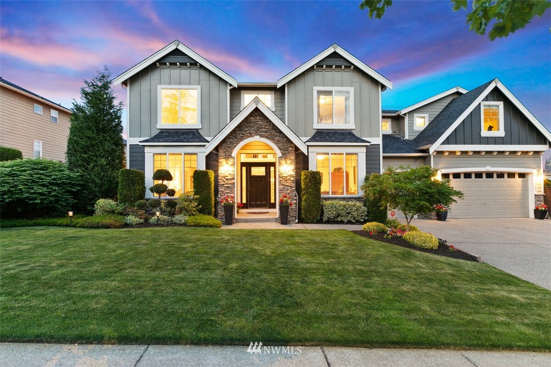 21703 31st Drive Southeast Bothell, WA 98021 - Photo 1 of 34 a front view of a house with a yard and garage