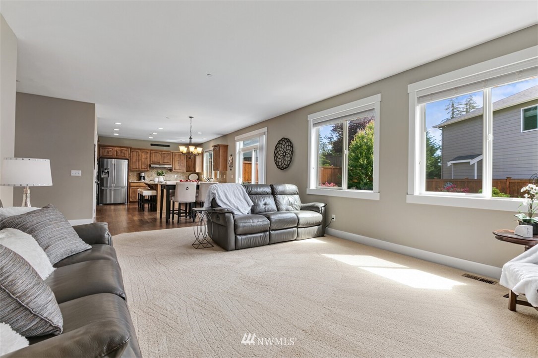 21703 31st Drive Southeast Bothell, WA 98021 - Photo 15 of 34 a living room with furniture and a window