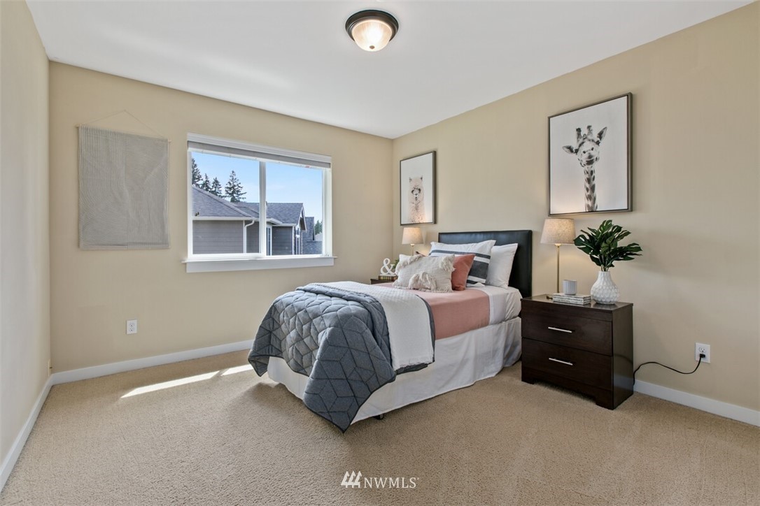 21703 31st Drive Southeast Bothell, WA 98021 - Photo 20 of 34 a bedroom with a bed and a potted plant