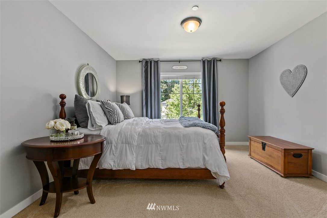 21703 31st Drive Southeast Bothell, WA 98021 - Photo 21 of 34 a bedroom with a bed and a table