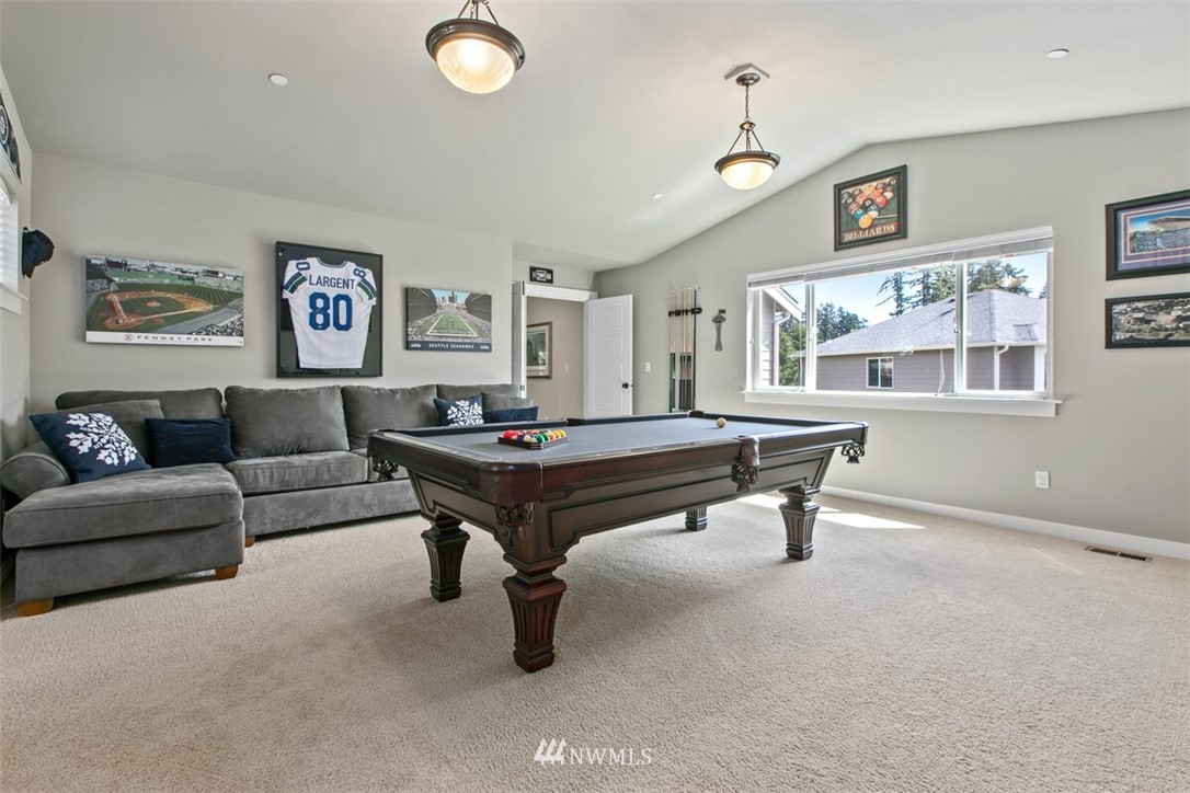21703 31st Drive Southeast Bothell, WA 98021 - Photo 24 of 34 a living room with furniture a window and a table