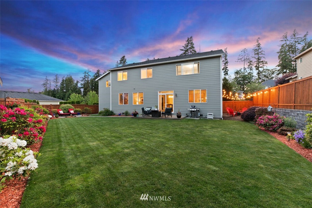 21703 31st Drive Southeast Bothell, WA 98021 - Photo 25 of 34 a front view of a house with garden