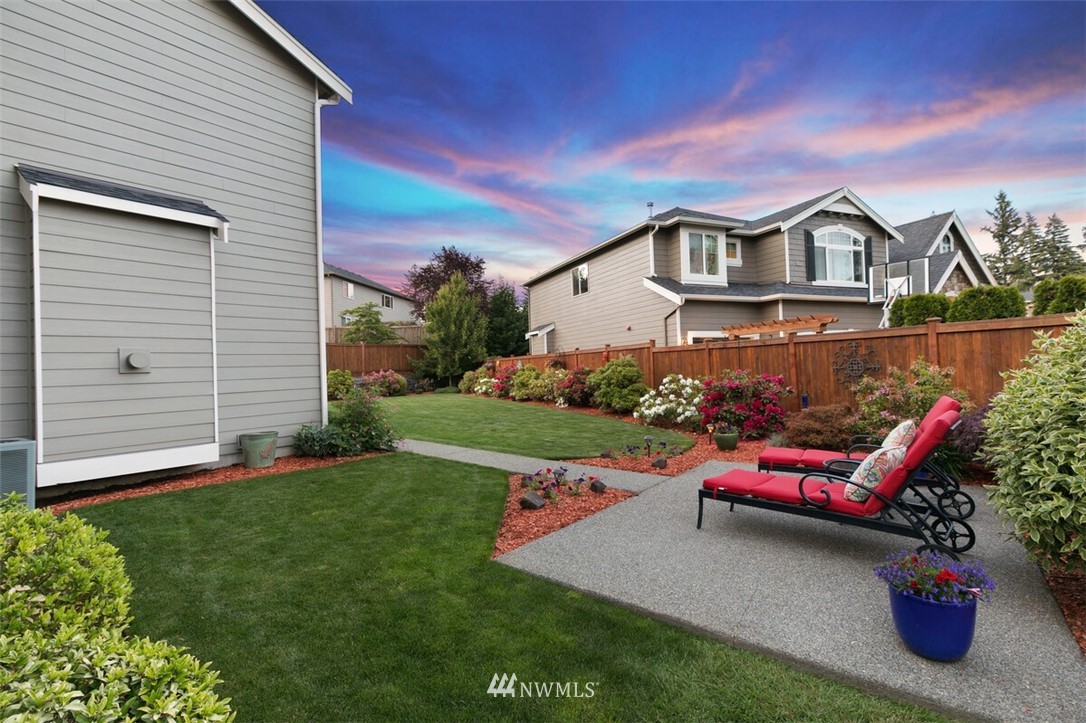 21703 31st Drive Southeast Bothell, WA 98021 - Photo 27 of 34 a front view of a house with a garden and deck