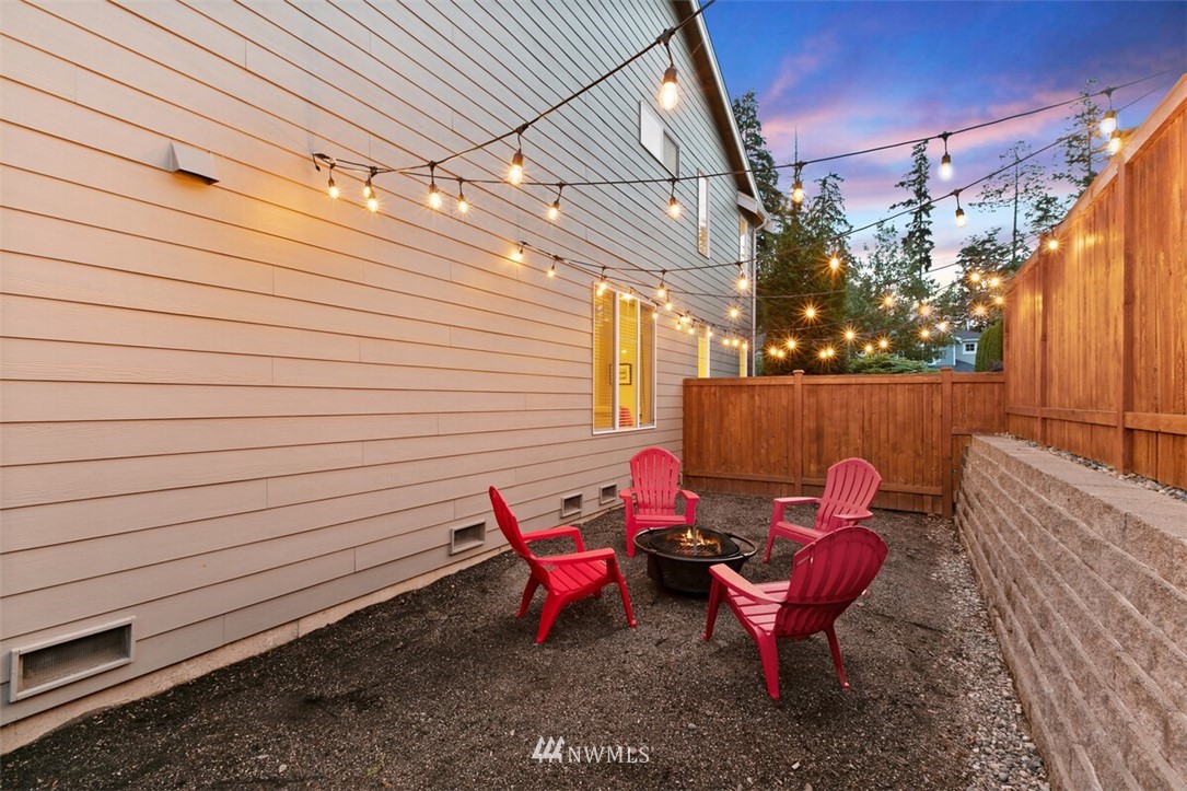 21703 31st Drive Southeast Bothell, WA 98021 - Photo 29 of 34 a backyard of a house with table and chairs