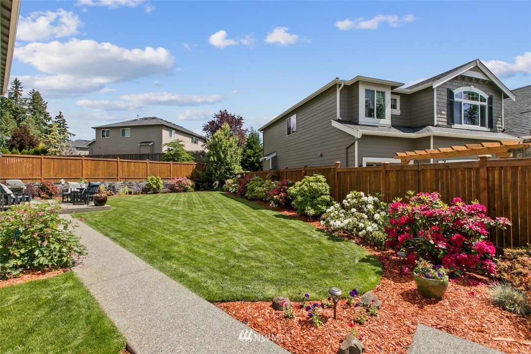 21703 31st Drive Southeast Bothell, WA 98021 - Photo 31 of 34 a front view of a house with a yard