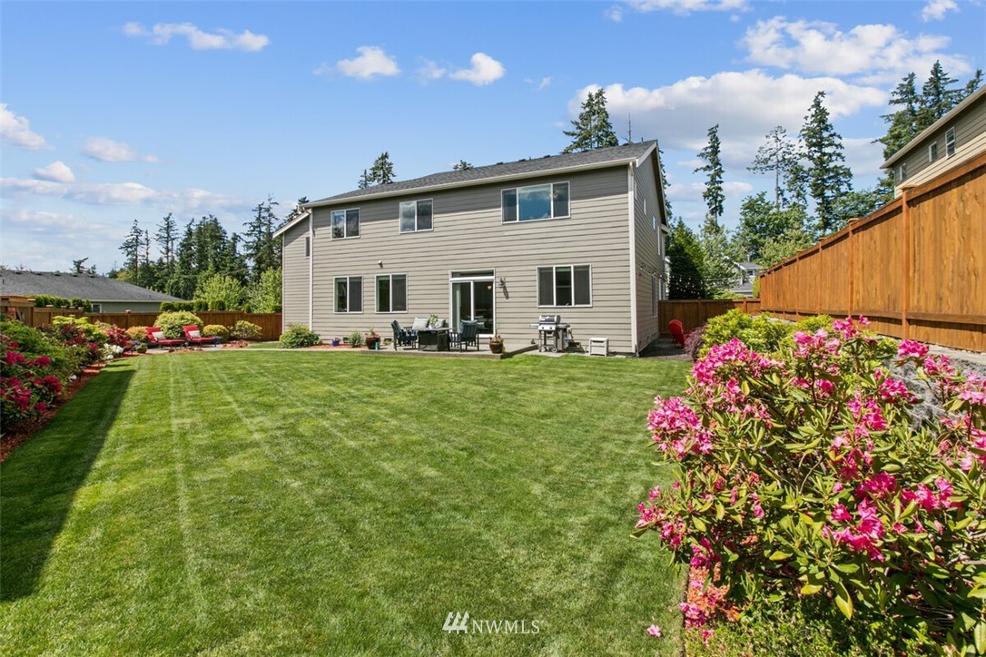 21703 31st Drive Southeast Bothell, WA 98021 - Photo 32 of 34 a front view of a house with garden