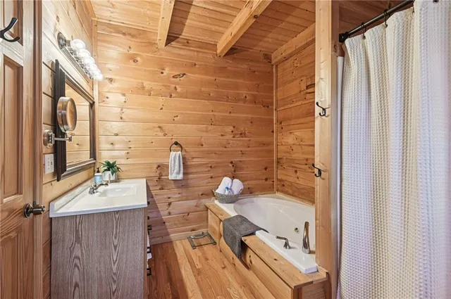 a bathroom with a tub and a sink