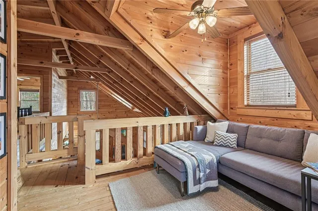 a balcony with furniture and a ceiling fan