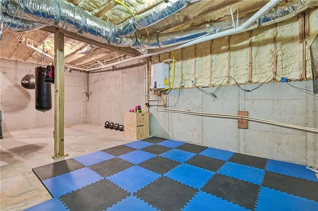 a view of a room with wooden floor and windows