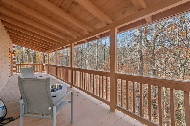 a view of a two chairs in the balcony