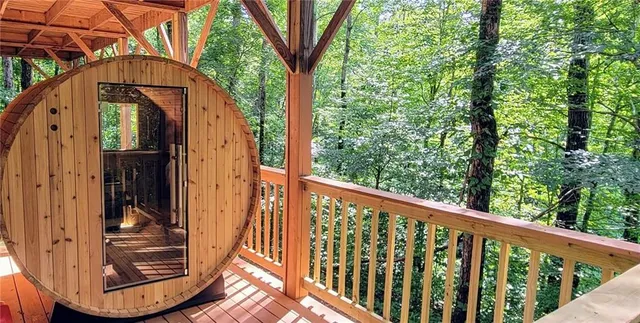 a view of a balcony with a small yard