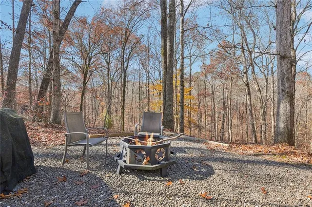 a view of a patio with a table and chairs