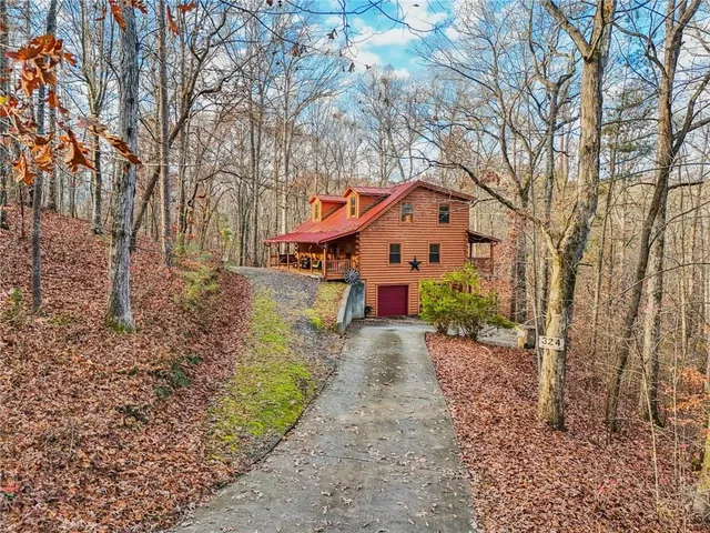 a front view of a house with a yard and pathway