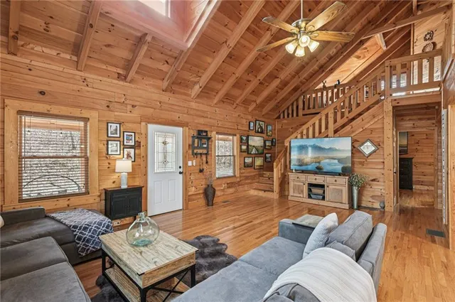 a living room with furniture and a flat screen tv
