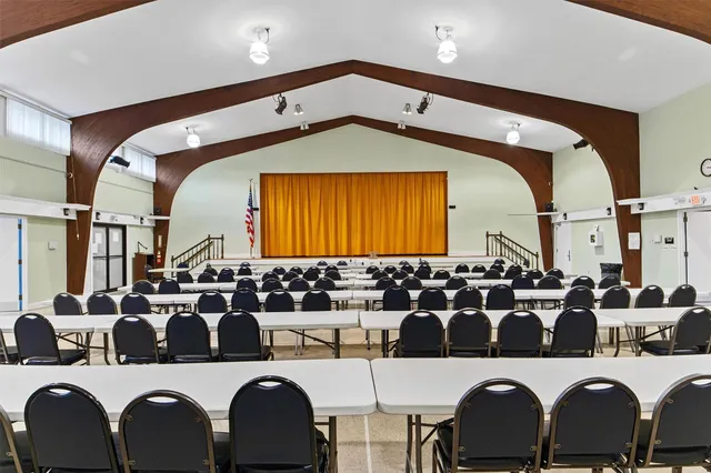 a room with furniture and pool table