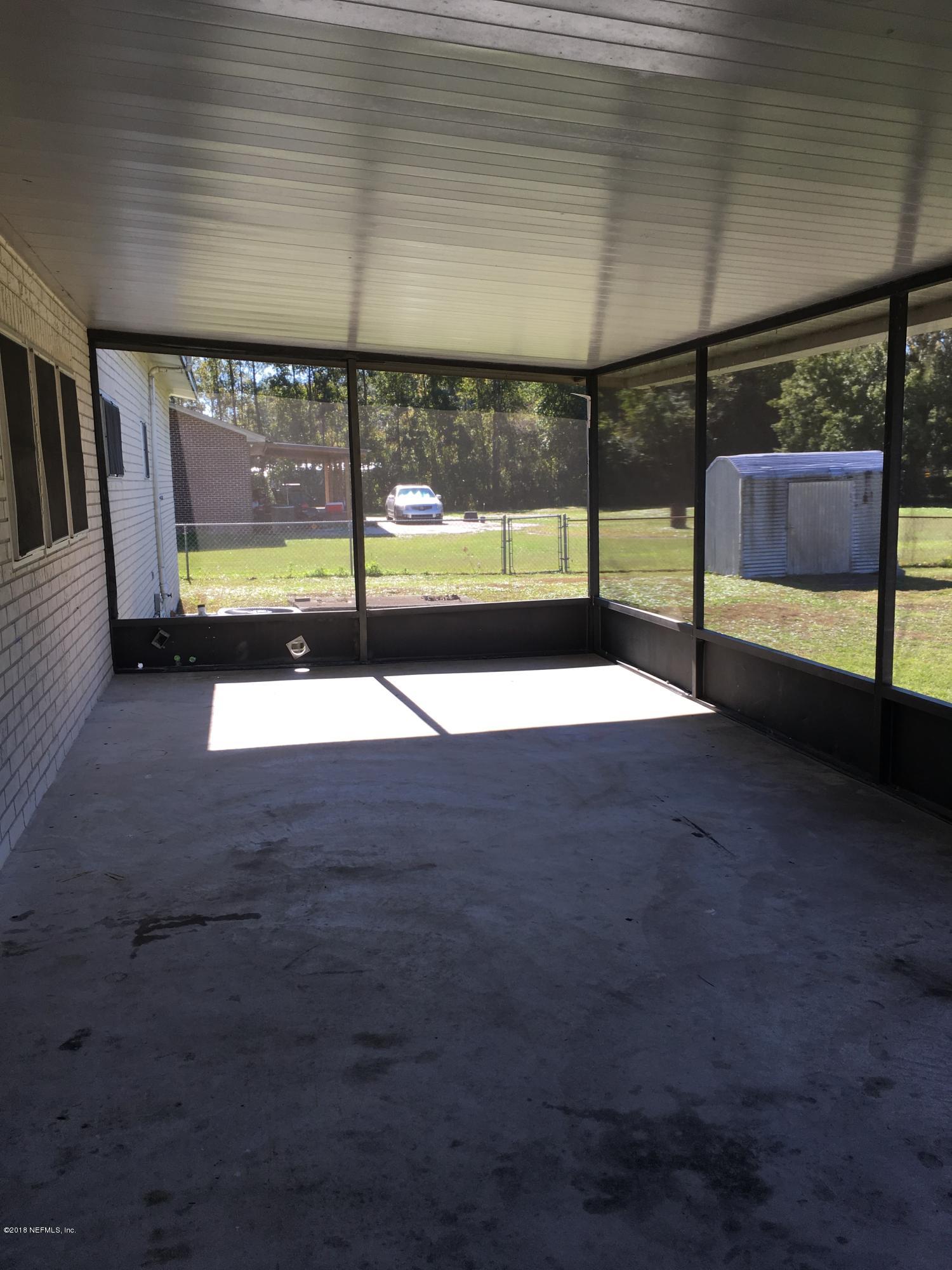 54199 Roy Booth Road Callahan, FL 32011 - Photo 5 of 23 a view of an empty room and window