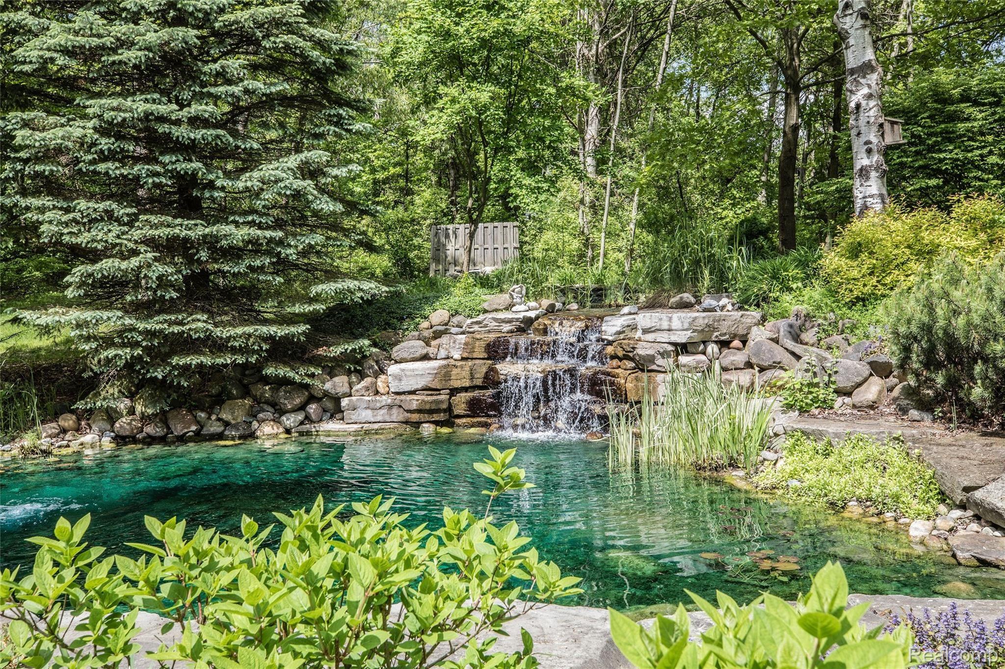 5542 Clarkston Road Clarkston, MI 48348 - Photo 75 of 85 TRANQUIL KOI-POND/WATERFALL; PROFESSIONALLY LANDSCAPED