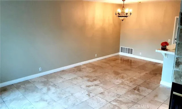 a living room with a fireplace and a flat screen tv
