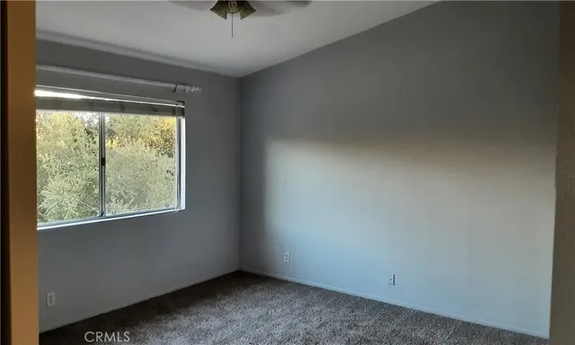 a view of an empty room and window