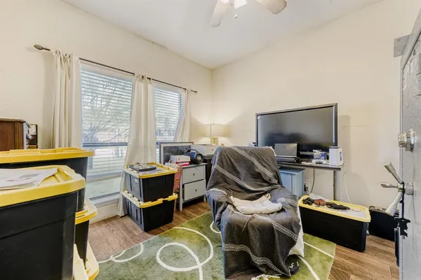 a room with furniture and a flat screen tv