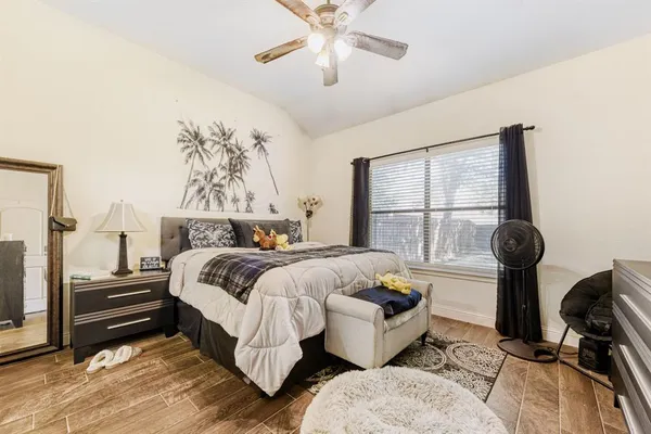 a bed room with a bed and a chandelier