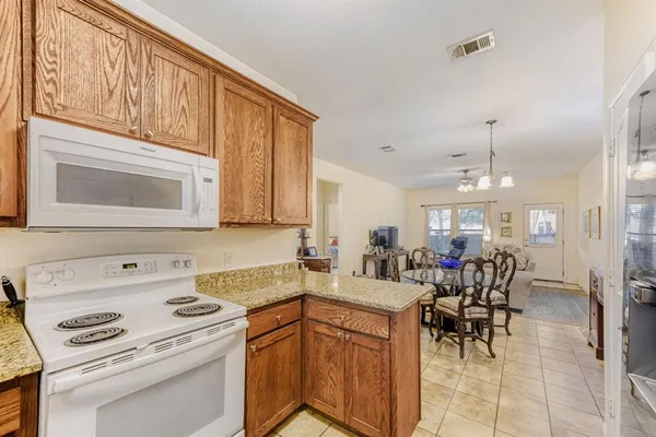 a kitchen that has a cabinets counter space and appliances