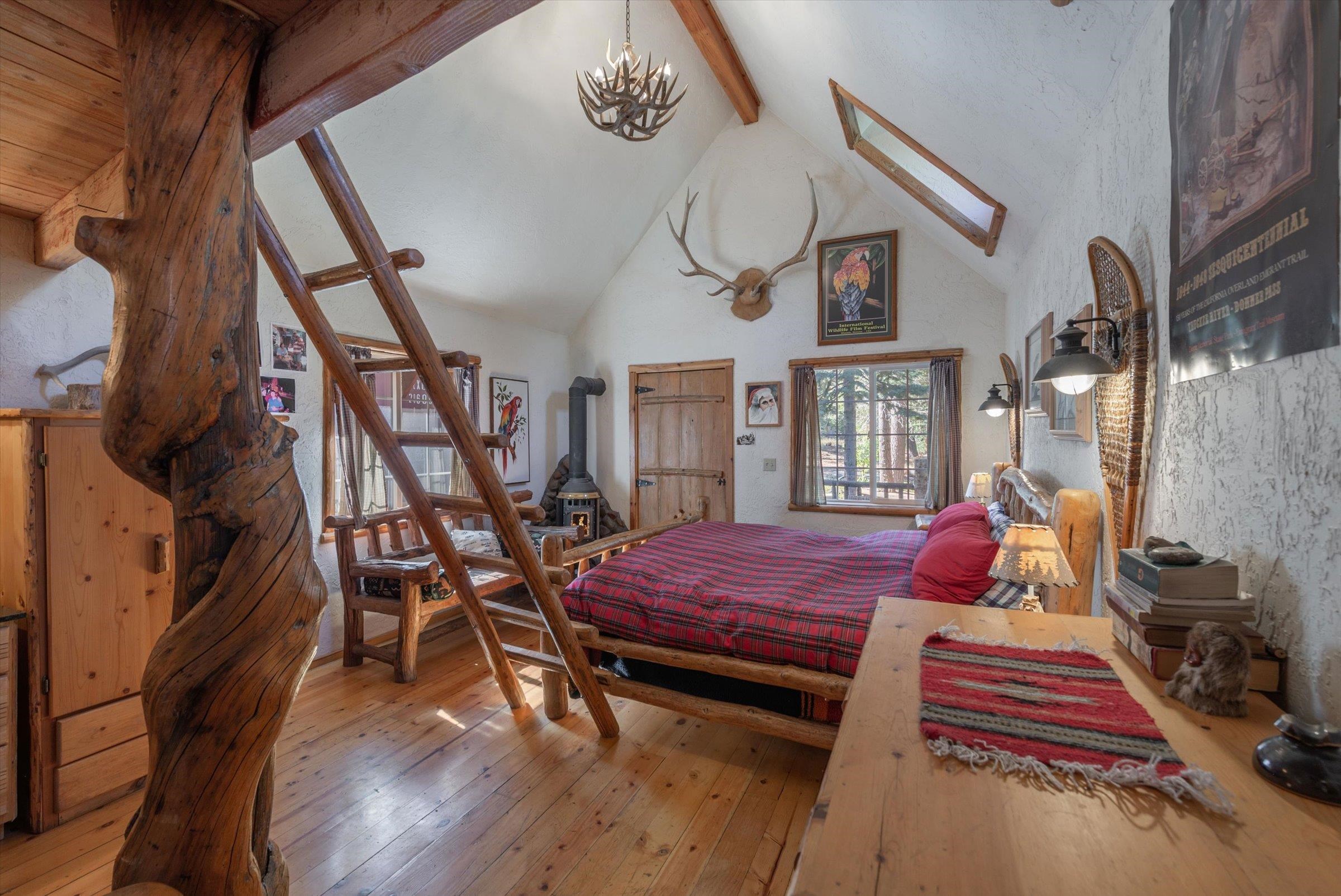 8600 Cold Stream Road Truckee, CA 96161 - Photo 16 of 28 a bedroom with furniture and wooden floor