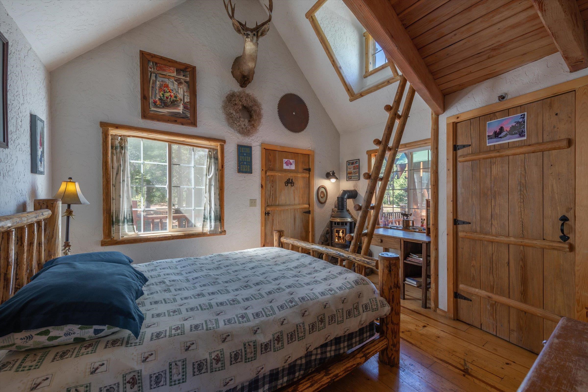 8600 Cold Stream Road Truckee, CA 96161 - Photo 19 of 28 a bedroom with a bed a window and dresser