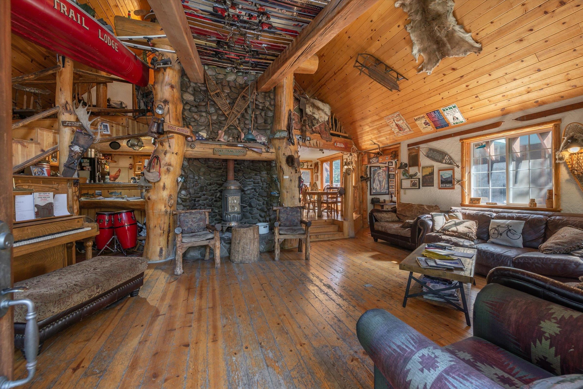 8600 Cold Stream Road Truckee, CA 96161 - Photo 3 of 28 a living room with furniture a fireplace and wooden floor