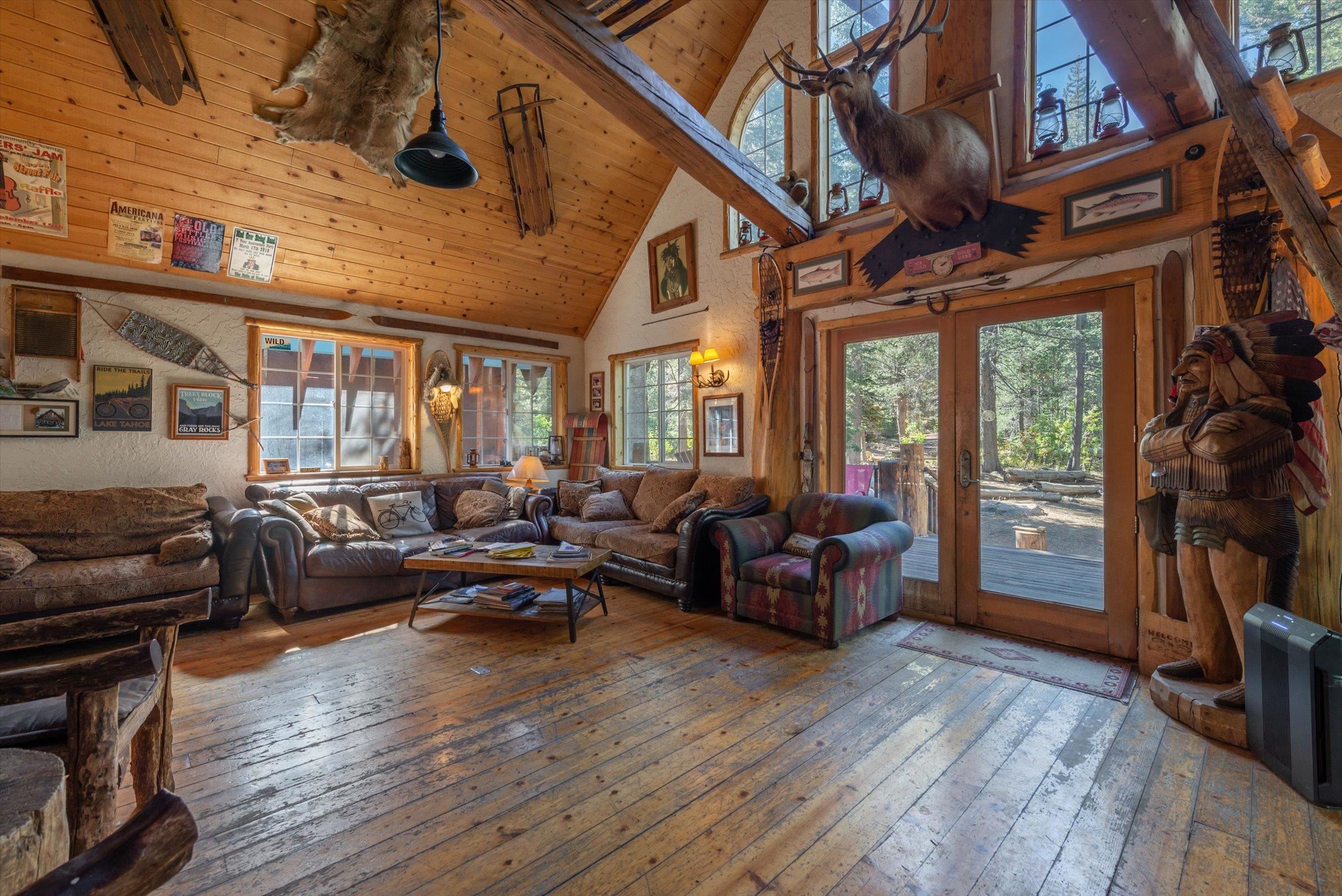 8600 Cold Stream Road Truckee, CA 96161 - Photo 4 of 28 a living room with furniture a fireplace and a floor to ceiling window