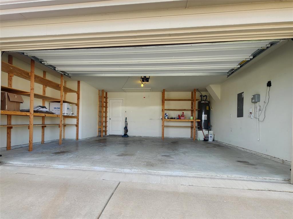 924 Amber Street Princeton, TX 75407 - Photo 17 of 19 Garage with Custom Shelving