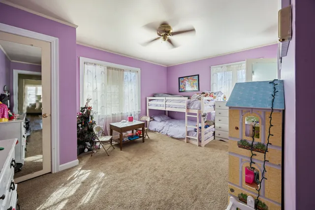 a living room with furniture and a table
