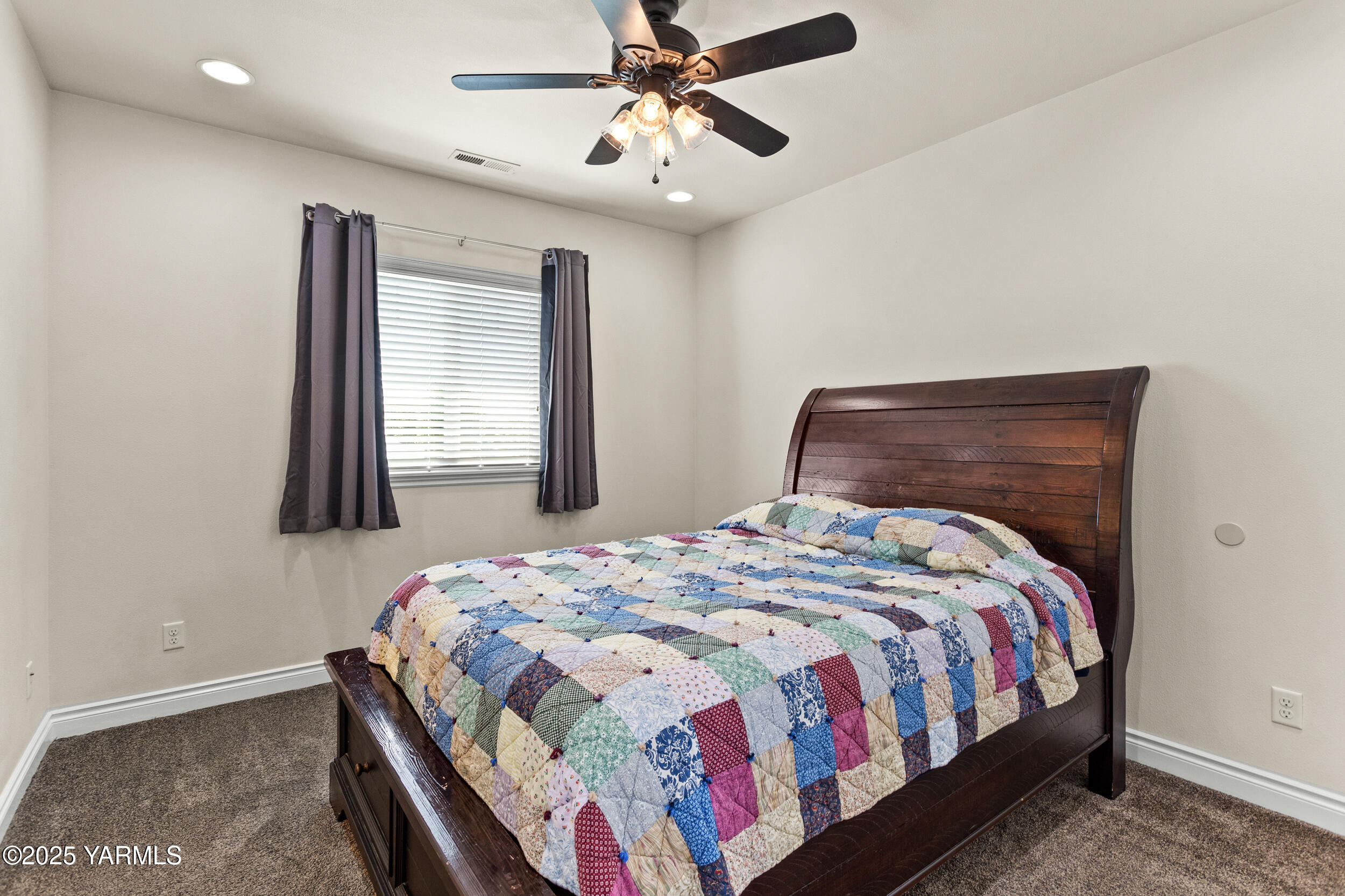 11906 Zier Road Yakima, WA 98908 - Photo 36 of 67 a bedroom with a bed and a window