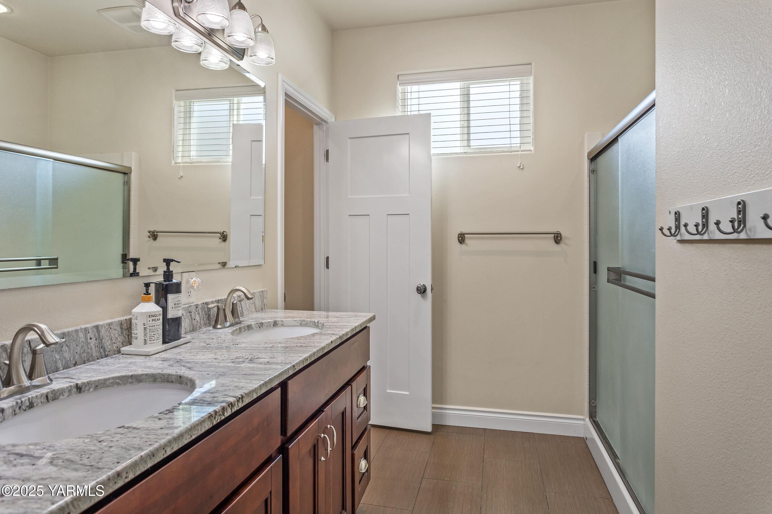 11906 Zier Road Yakima, WA 98908 - Photo 38 of 67 a bathroom with a granite countertop sink and a mirror