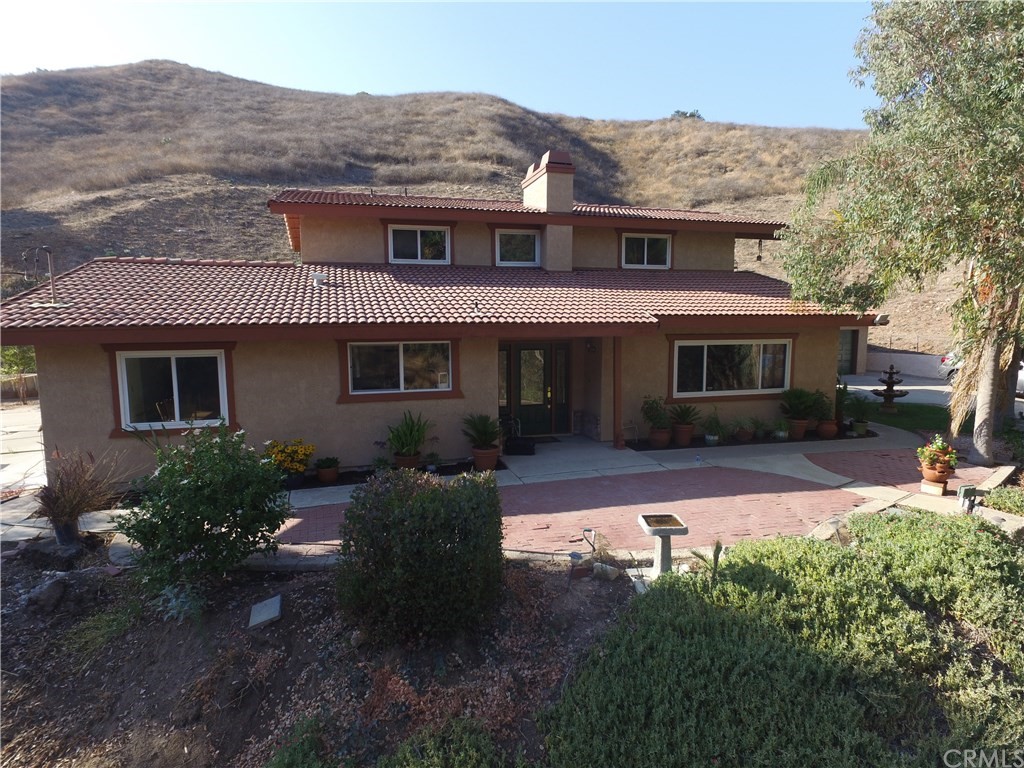 8260 Weirick Road Corona, CA 92883 - Photo 1 of 40 a front view of a house with garden