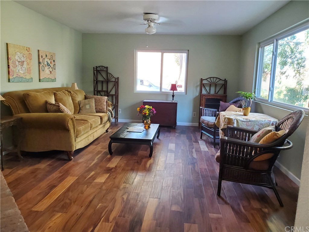 8260 Weirick Road Corona, CA 92883 - Photo 11 of 40 a living room with furniture and a large window