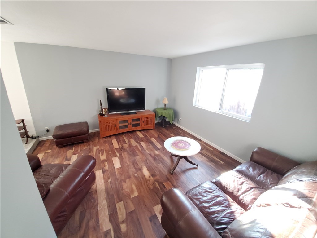 8260 Weirick Road Corona, CA 92883 - Photo 12 of 40 a living room with furniture and a flat screen tv