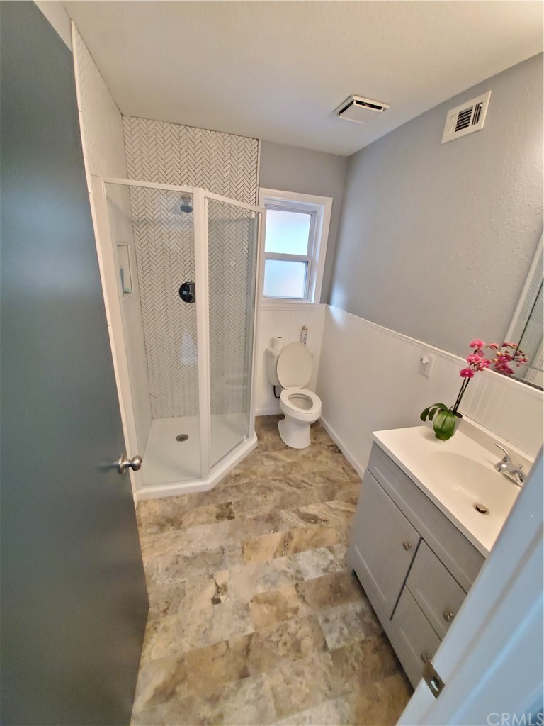 8260 Weirick Road Corona, CA 92883 - Photo 13 of 40 a bathroom with a sink toilet and shower
